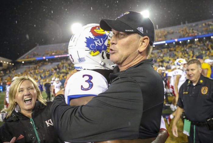 Sep 10, 2022; Morgantown, West Virginia, USA; Kansas Jayhawks head coach Lance Leipold celebrates with cornerback Ra'Mello Dotson (3) after beating the West Virginia Mountaineers at Mountaineer Field at Milan Puskar Stadium.
