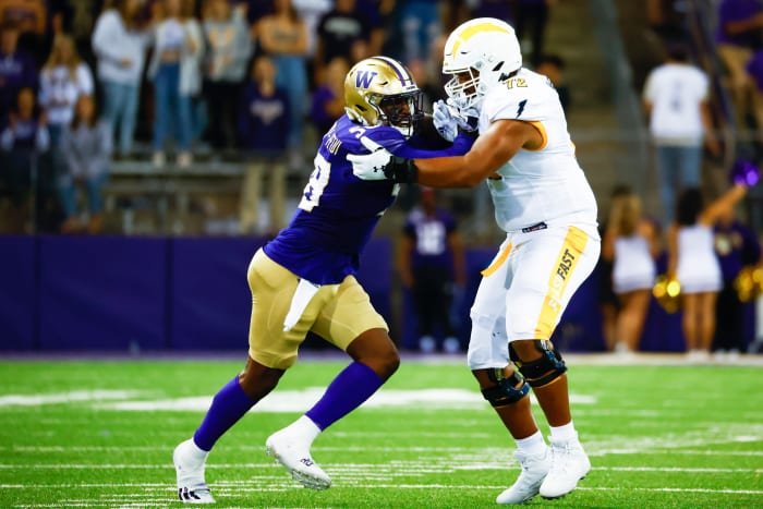 Sep 3, 2022; Seattle, Washington, USA; Washington Huskies defensive lineman Zion Tupuola-Fetui (58) rushes the passer against Kent State Golden Flashes offensive lineman Marcellus Marshall (72) during the third quarter at Alaska Airlines Field at Husky Stadium.