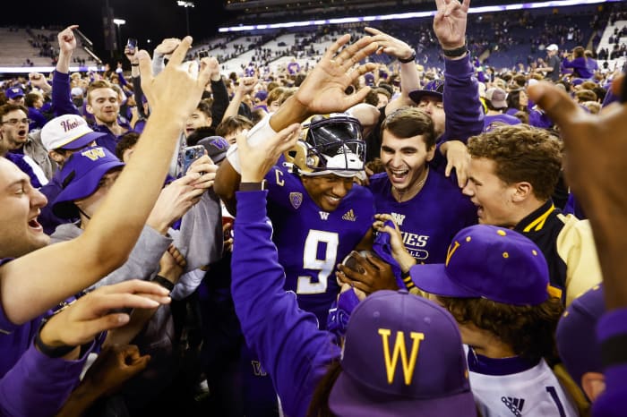 Sep 17, 2022; Seattle, Washington, USA; Washington Huskies quarterback Michael Penix Jr. (9) celebrates with fans following a 39-28 victory against the Michigan State Spartans at Alaska Airlines Field at Husky Stadium.
