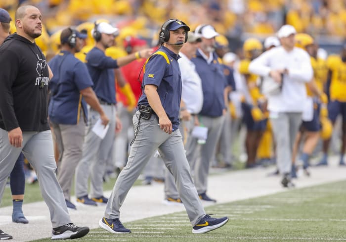 Sep 10, 2022; Morgantown, West Virginia, USA; West Virginia Mountaineers head coach Neal Brown watches during the first quarter against the Kansas Jayhawks at Mountaineer Field at Milan Puskar Stadium.