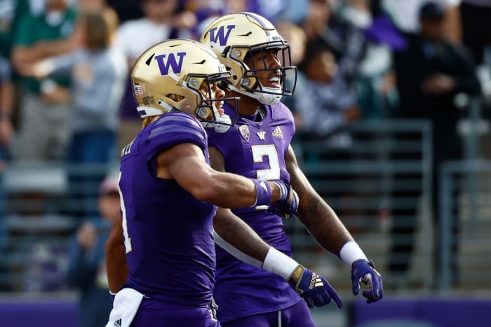 Sep 17, 2022; Seattle, Washington, USA; Washington Huskies wide receiver Ja'Lynn Polk (2) celebrates with wide receiver Rome Odunze (1) after catching a touchdown pass against the Michigan State Spartans during the first quarter at Alaska Airlines Field at Husky Stadium.
