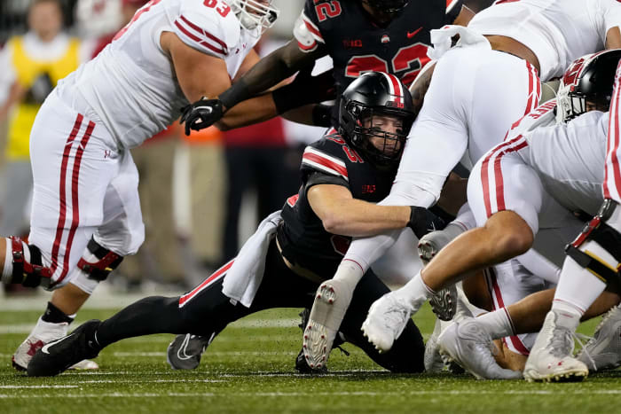 Sep 24, 2022; Columbus, Ohio, USA; Ohio State Buckeyes linebacker Tommy Eichenberg (35) tackles Wisconsin Badgers running back Braelon Allen (0) during the first half of the NCAA Division I football game at Ohio Stadium.