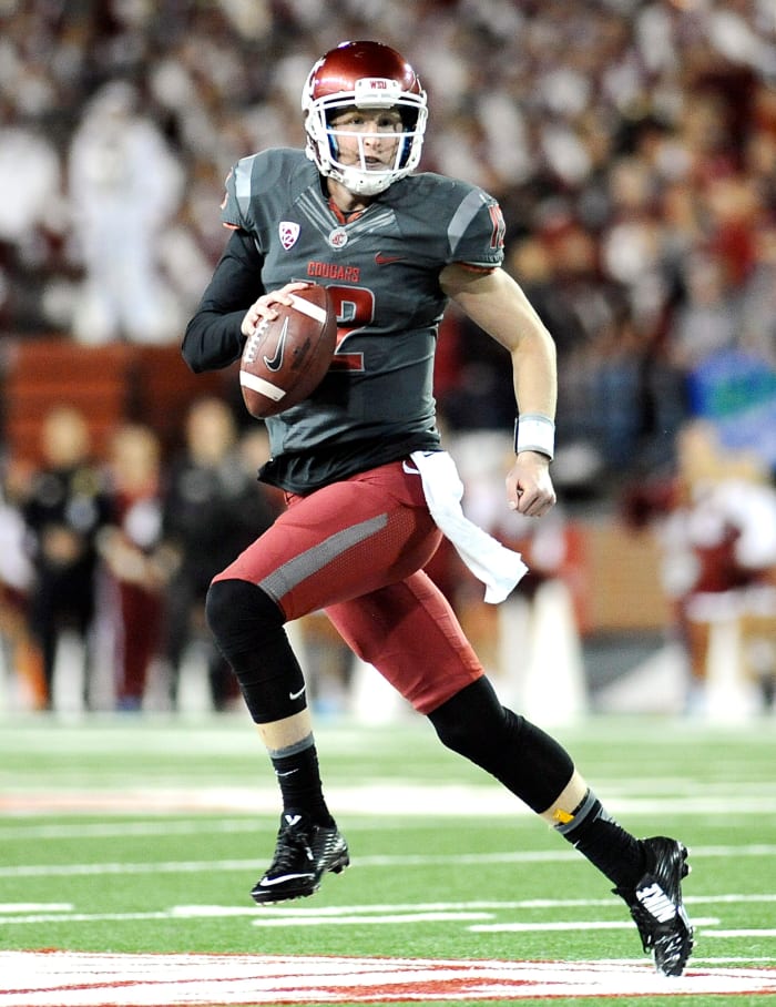 Oct 4, 2014; Pullman, WA, USA; Washington State Cougars quarterback Connor Halliday (12) rolls out against the California Golden Bears during the second half at Martin Stadium. The Bear beat the Cougars 60-59.