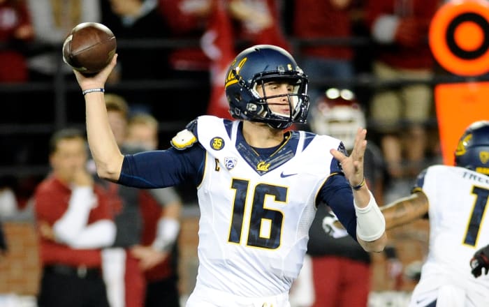 Caption:Oct 4, 2014; Pullman, WA, USA; California Golden Bears quarterback Jared Goff (16) drops back for a pass against the Washington State Cougars during the first half at Martin Stadium.