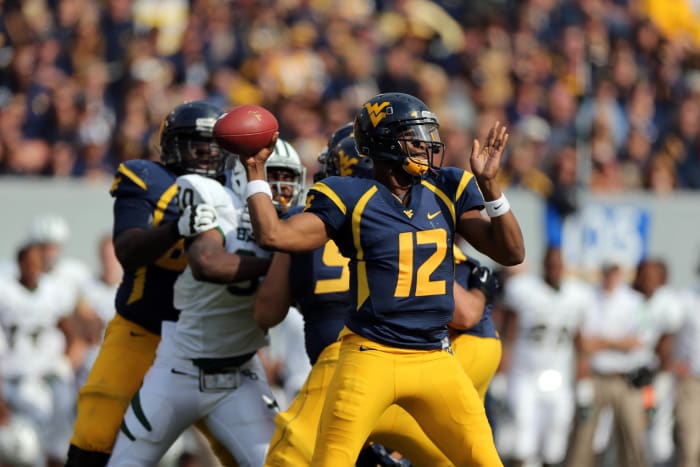 September 29, 2012; Morgantown, WV, USA; West Virginia Mountaineers quarterback Geno Smith (12) drops back to pass in the second half in the game against the Baylor Bears at Milan Puskar Stadium. West Virginia defeated Baylor 70-63.