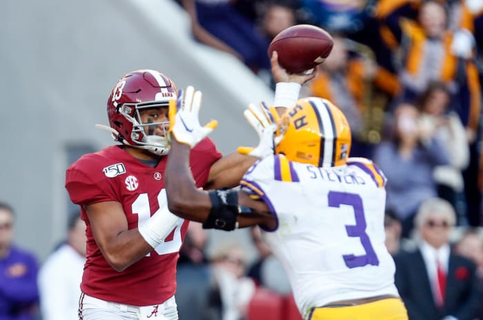 Nov 9, 2019; Tuscaloosa, AL, USA; Alabama Crimson Tide quarterback Tua Tagovailoa (13) throws a pass against LSU Tigers safety JaCoby Stevens (3) during the first half at Bryant-Denny Stadium.
