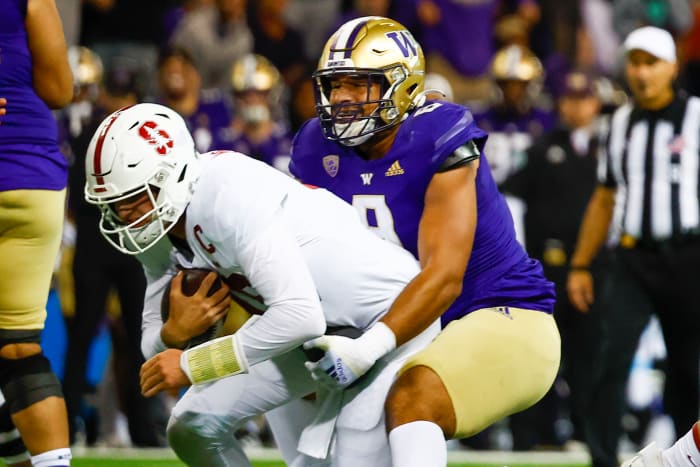 Sep 24, 2022; Seattle, Washington, USA; Washington Huskies defensive lineman Bralen Trice (8) sacks Stanford Cardinal quarterback Tanner McKee (18) during the first quarter at Alaska Airlines Field at Husky Stadium.