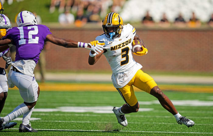Sep 17, 2022; Columbia, Missouri, USA; Missouri Tigers wide receiver Luther Burden III (3) runs the ball against Abilene Christian Wildcats defensive back Triston Anderson (12) during the first half at Faurot Field at Memorial Stadium.
