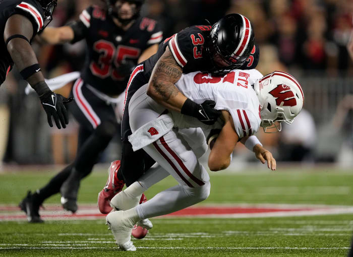 Sep 24, 2022; Columbus, Ohio, USA; Ohio State Buckeyes defensive end Jack Sawyer (33) sacks Wisconsin Badgers quarterback Graham Mertz (5) during the first half of the NCAA Division I football game at Ohio Stadium.