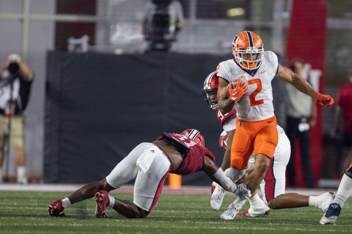Sep 2, 2022; Bloomington, Indiana, USA; Illinois Fighting Illini running back Chase Brown (2) runs the ball while Indiana Hoosiers defensive lineman Beau Robbins (41) defends in the first quarter at Memorial Stadium.
