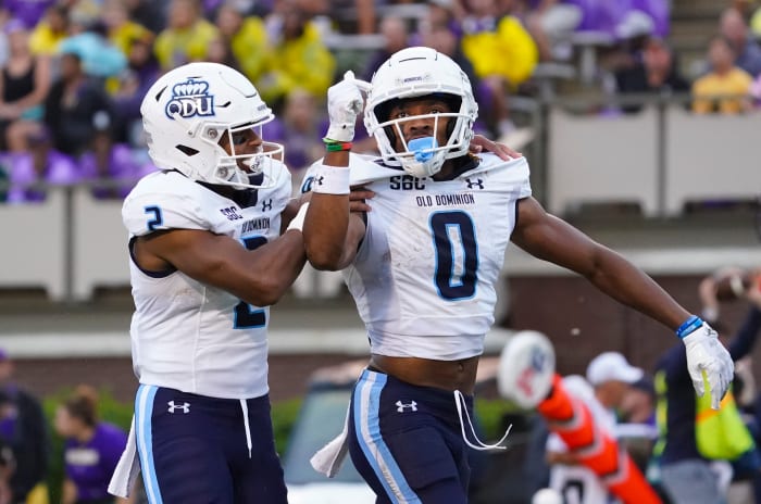 Sep 10, 2022; Greenville, North Carolina, USA; Old Dominion Monarchs wide receiver Ali Jennings III (0) is congratulated by running back Blake Watson (2) after his touchdown catch East Carolina Pirates during the first half at Dowdy-Ficklen Stadium.