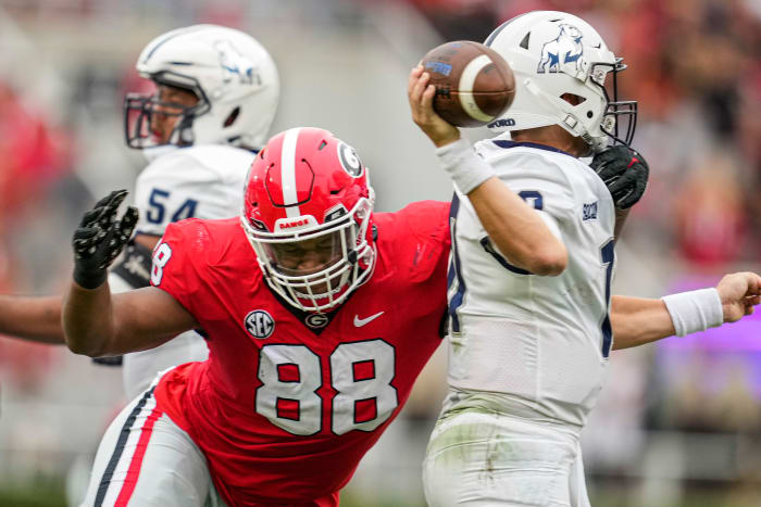 Sep 10, 2022; Athens, Georgia, USA; Georgia Bulldogs defensive lineman Jalen Carter (88) hits Samford Bulldogs quarterback Michael Hiers (10) during the first half at Sanford Stadium.