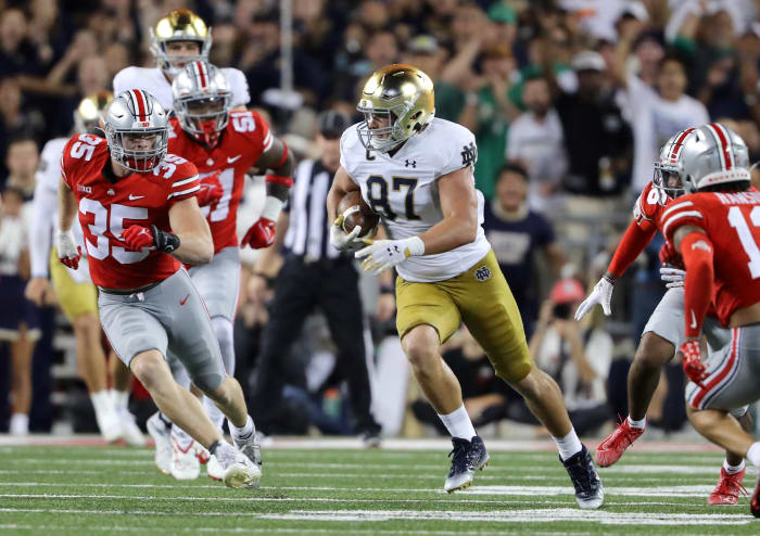 Sep 3, 2022; Columbus, Ohio, USA; Notre Dame Fighting Irish tight end Michael Mayer (87) runs after the catch as Ohio State Buckeyes linebacker Tommy Eichenberg (35) defends during the third quarter at Ohio Stadium.