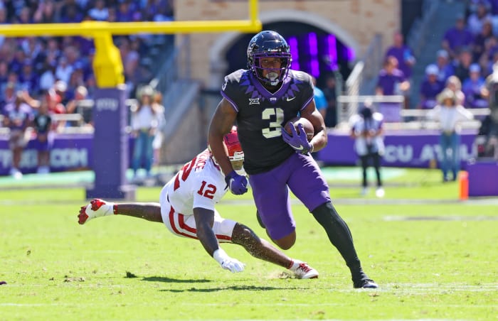 Oct 1, 2022; Fort Worth, Texas, USA; TCU Horned Frogs running back Emari Demercado (3) runs with the ball past Oklahoma Sooners defensive back Key Lawrence (12) during the first half at Amon G. Carter Stadium.