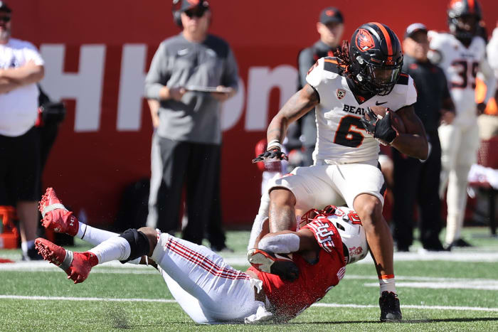 Oct 1, 2022; Salt Lake City, Utah, USA; Oregon State Beavers running back Damien Martinez (6) is tackles by Utah Utes linebacker Mohamoud Diabate (3) in the third quarter at Rice-Eccles Stadium.