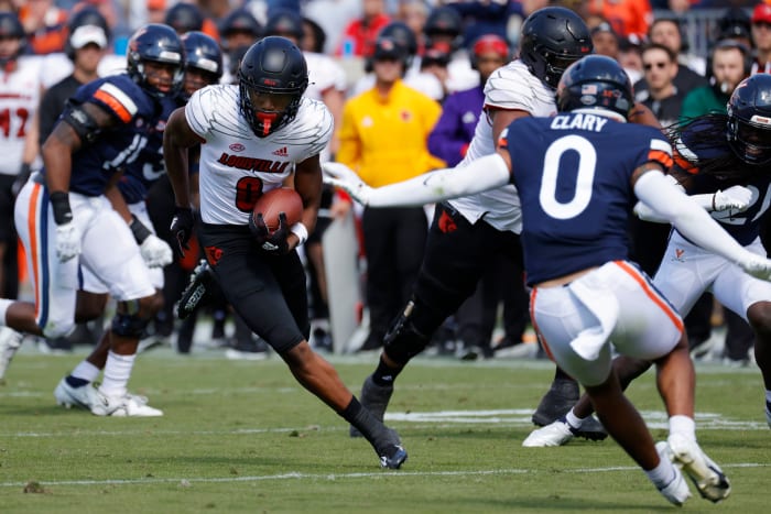 Oct 8, 2022; Charlottesville, Virginia, USA; Louisville Cardinals wide receiver Tyler Hudson (0) runs with the ball as Virginia Cavaliers safety Antonio Clary (0) chases during the second quarter at Scott Stadium