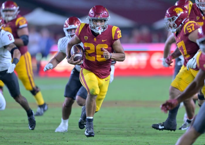 Oct 8, 2022; Los Angeles, California, USA; USC Trojans running back Travis Dye (26) carries the ball against the Washington State Cougars in the second half at United Airlines Field at Los Angeles Memorial Coliseum.