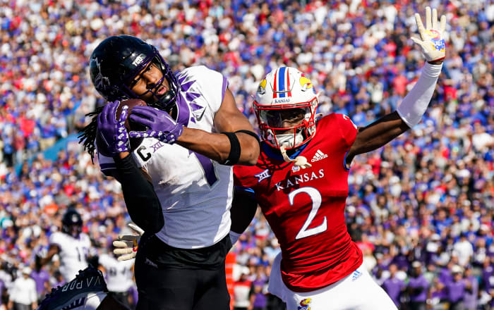 Oct 8, 2022; Lawrence, Kansas, USA; TCU Horned Frogs wide receiver Quentin Johnston (1) catches a touchdown pass against Kansas Jayhawks cornerback Cobee Bryant (2) during the second half at David Booth Kansas Memorial Stadium.