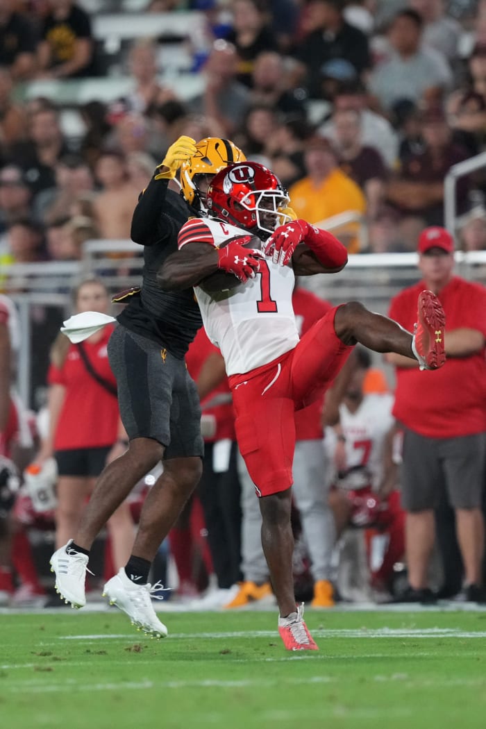 Sep 24, 2022; Tempe, Arizona, USA; Utah Utes cornerback Clark Phillips III (1) intercepts a pass intended for Arizona State Sun Devils wide receiver Charles Hall IV (0) during the first half at Sun Devil Stadium.