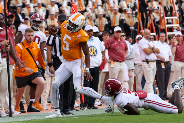 Oct 15, 2022; Knoxville, Tennessee, USA; Tennessee Volunteers quarterback Hendon Hooker (5) is forced out of bounds after a run by Alabama Crimson Tide defensive back Terrion Arnold (3) during the first half at Neyland Stadium.