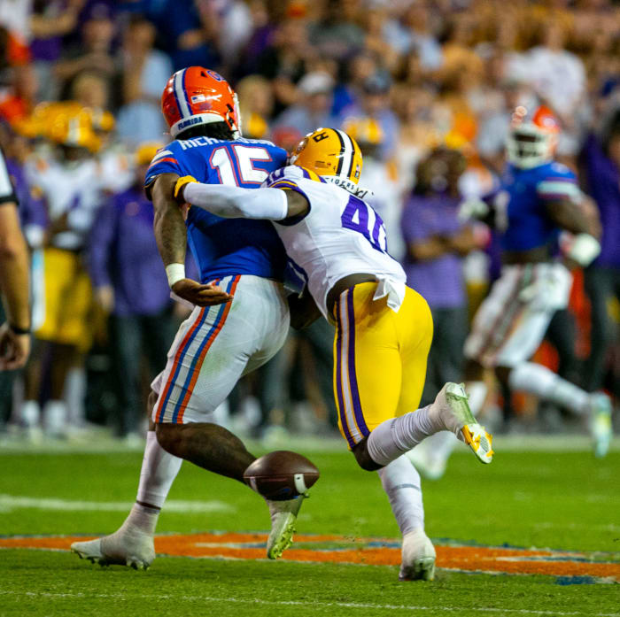 LSU Tigers linebacker Harold Perkins Jr. (40) clobbers Florida Gators quarterback Anthony Richardson (15) shaking loose the ball as Florida takes on LSU at Steve Spurrier Field at Ben Hill Griffin Stadium in Gainesville, FL on Saturday, October 15, 2022. The play was ruled an incomplete pass.