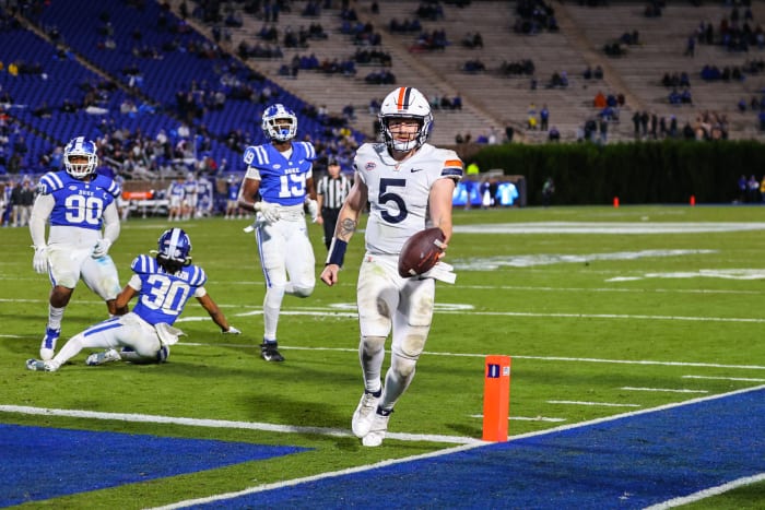 Oct 1, 2022; Durham, North Carolina, USA; Virginia Cavaliers quarterback Brennan Armstrong (5) runs the ball against the Duke Blue Devils during the second half at Wallace Wade Stadium.