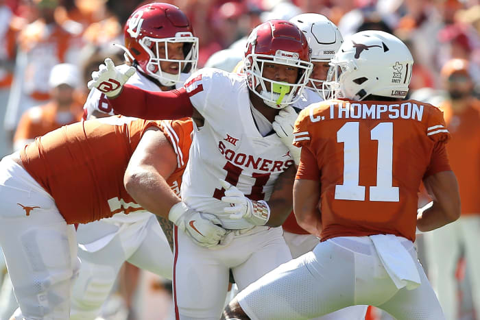 Oklahoma's Nik Bonitto (11) tries to get to Texas' Casey Thompson (11) during the Red River Showdown college football game between the University of Oklahoma Sooners (OU) and the University of Texas (UT) Longhorns at the Cotton Bowl in Dallas, Saturday, Oct. 9, 2021. Oklahoma won 55-48. Ou Vs Texas