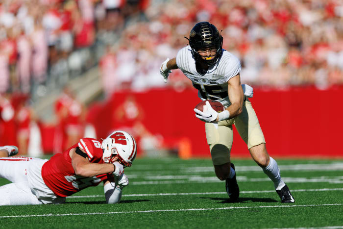 Oct 22, 2022; Madison, Wisconsin, USA; Purdue Boilermakers wide receiver Charlie Jones (15) rushes with the football after catching a pass during the first quarter against the Wisconsin Badgers at Camp Randall Stadium.