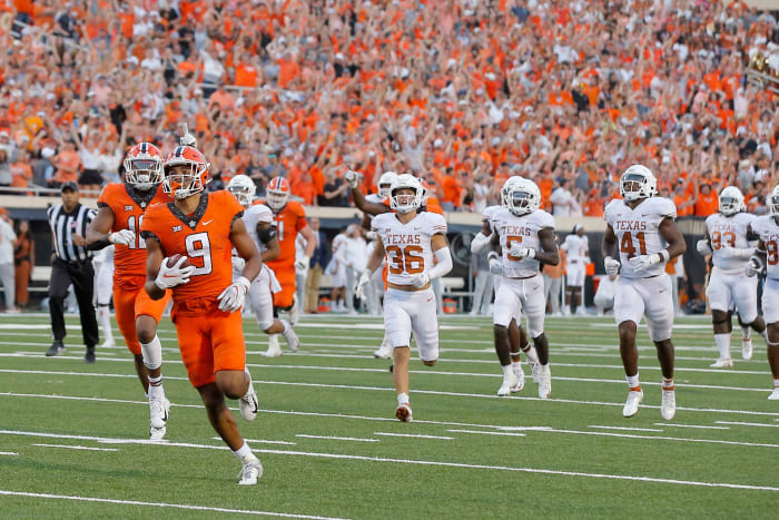 Oklahoma State wide receiver Bryson Green (9) runs to the end zone for the winning touchdown in a 41-34 victory against Texas on Saturday at Boone Pickens Stadium in Stillwater.
