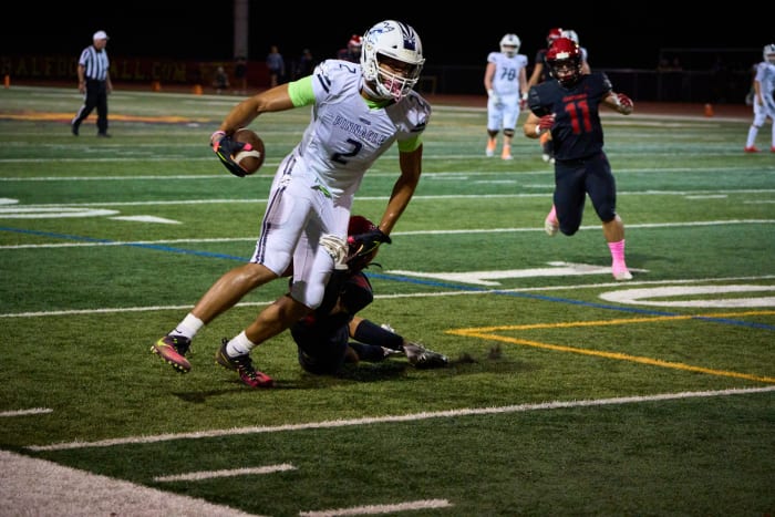 Oct 14, 2022; Scottsdale, AZ, USA; Pinnacle Pioneers senior tight end Duce Robinson (2) is brought down by Chaparral Firebirds middle linebacker Jaden Berman (31) at Chaparral High School s football field.