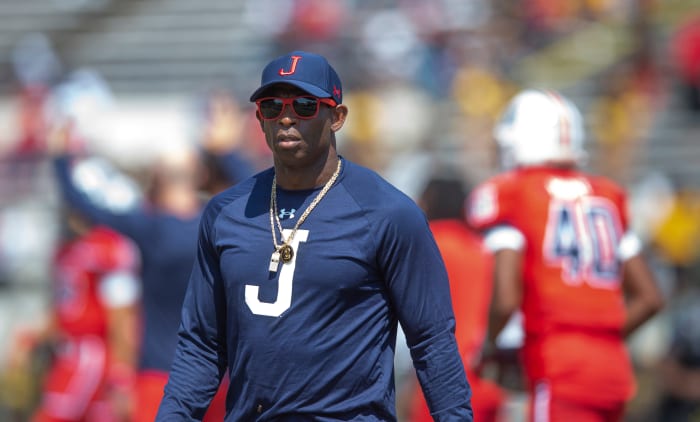 Jackson State coach Deion Sanders walks on the field during warmup before his team's game against Grambling State in Jackson, Miss., Saturday, Sept. 17, 2022.