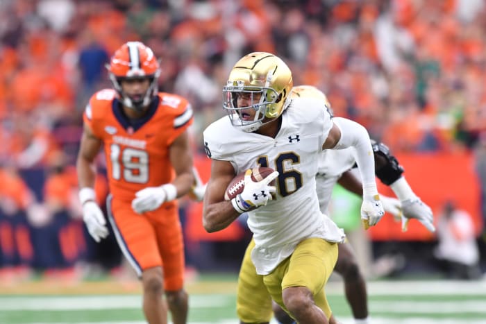 Oct 29, 2022; Syracuse, New York, USA; Notre Dame Fighting Irish safety Brandon Joseph (16) returns an interception for a touchdown against the Syracuse Orange in the first quarter at JMA Wireless Dome.