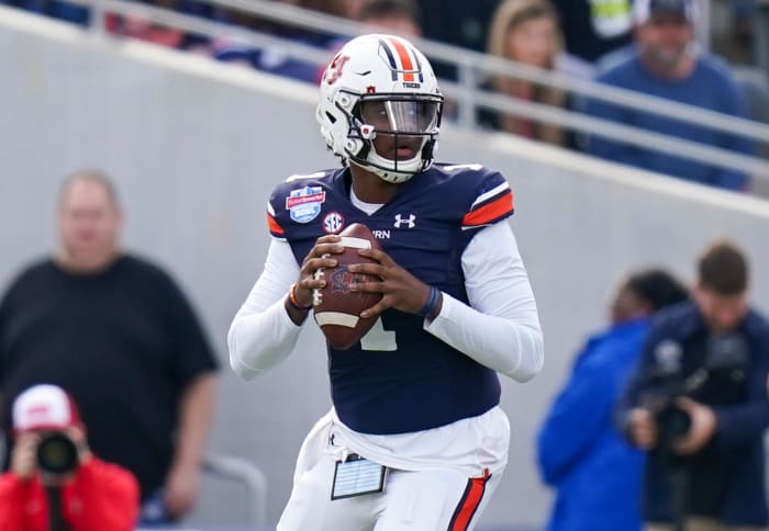 Dec 28, 2021; Birmingham, Alabama, USA; Auburn Tigers quarterback TJ Finley (1) looks to pass against the Houston Cougars during the first half of the 2021 Birmingham Bowl at Protective Stadium.