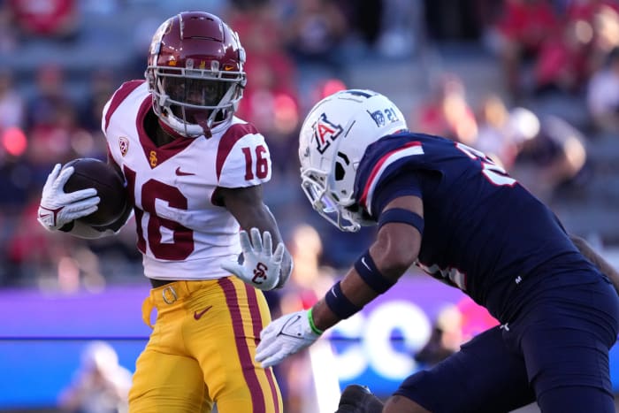 Oct 29, 2022; Tucson, Arizona, USA; USC Trojans wide receiver Tahj Washington (16) runs against Arizona Wildcats safety Jaxen Turner (21) during the first half at Arizona Stadium.