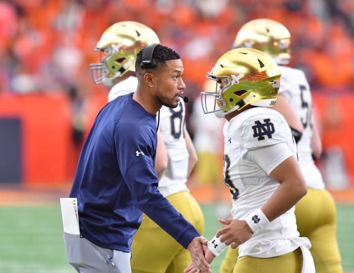 Oct 29, 2022; Syracuse, New York, USA; Notre Dame Fighting Irish head coach Marcus Freeman greets his players after a touchdown against the Syracuse Orange in the first quarter at JMA Wireless Dome.