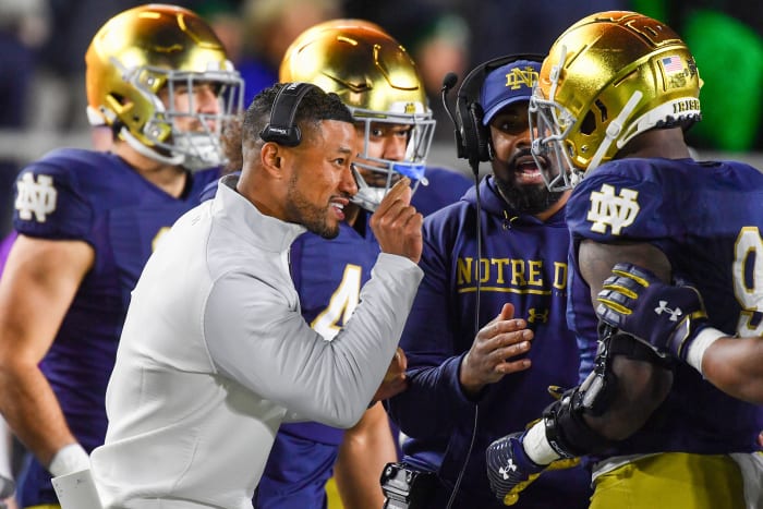 Nov 5, 2022; South Bend, Indiana, USA; Notre Dame Fighting Irish head coach Marcus Freeman talks to defensive lineman Justin Ademilola (9) in the first quarter against the Clemson Tigers at Notre Dame Stadium.