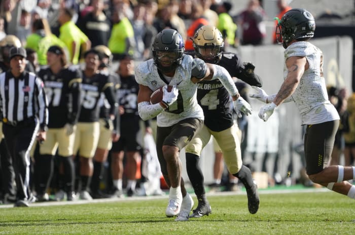 Nov 5, 2022; Boulder, Colorado, USA; Oregon Ducks defensive back Christian Gonzalez (0) returns a interception in the third quarter against the Colorado Buffaloes at Folsom Field.