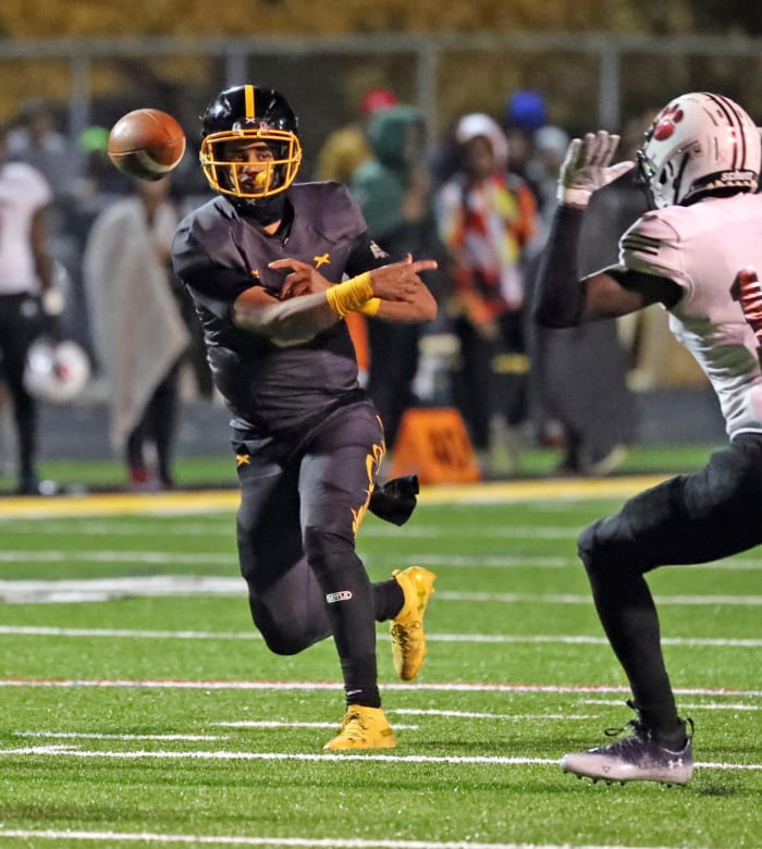 Detroit King quarterback Dante Moore (5) passes against River Rouge during first-half action on Friday, Oct. 28, 2022.