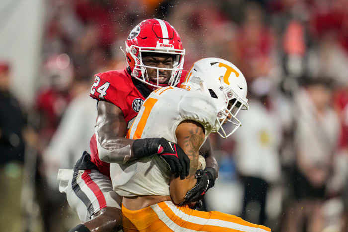 Nov 5, 2022; Athens, Georgia, USA; Georgia Bulldogs defensive back Malaki Starks (24) tackles Tennessee Volunteers wide receiver Jalin Hyatt (11) during the second half at Sanford Stadium.