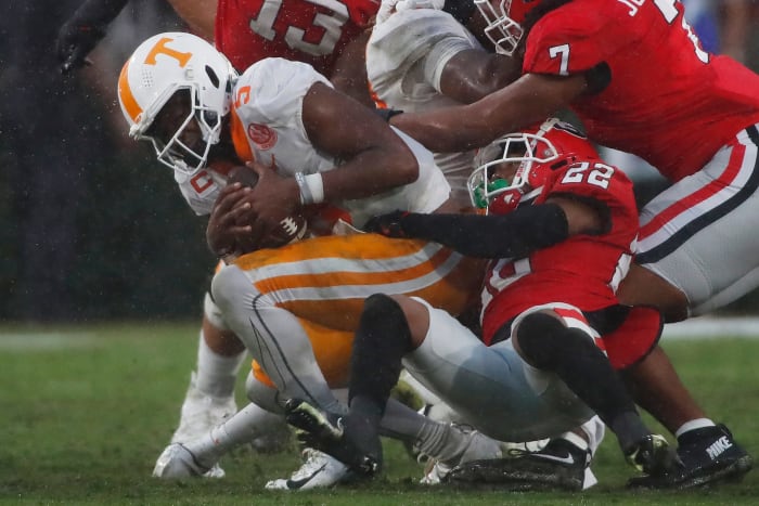Tennessee quarterback Hendon Hooker (5) is sacked by Georgia defensive back Javon Bullard (22) during the second half of a NCAA college football game between Tennessee and Georgia in Athens, Ga., on Saturday, Nov. 5, 2022. Georgia won 27-13.