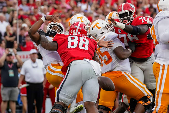 Nov 5, 2022; Athens, Georgia, USA; Tennessee Volunteers quarterback Hendon Hooker (5) fumbles the ball in the end zone after being hit by Georgia Bulldogs defensive lineman Jalen Carter (88) during the first quarter at Sanford Stadium.