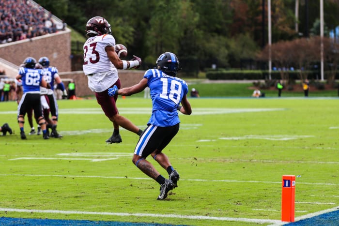 Nov 12, 2022; Durham, North Carolina, USA; Virginia Tech Hokies defensive back Mansoor Delane (23) intercepts the ball from Duke Blue Devils wide receiver Malik Bowen-Sims (18) during the first half against Virginia Tech at Wallace Wade Stadium.