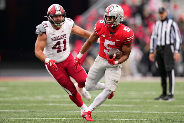 Nov 12, 2022; Columbus, Ohio, USA; Ohio State Buckeyes running back Dallan Hayden (5) runs past Indiana Hoosiers defensive lineman Beau Robbins (41) during the second half of the NCAA football game at Ohio Stadium. Ohio State won 56-14.