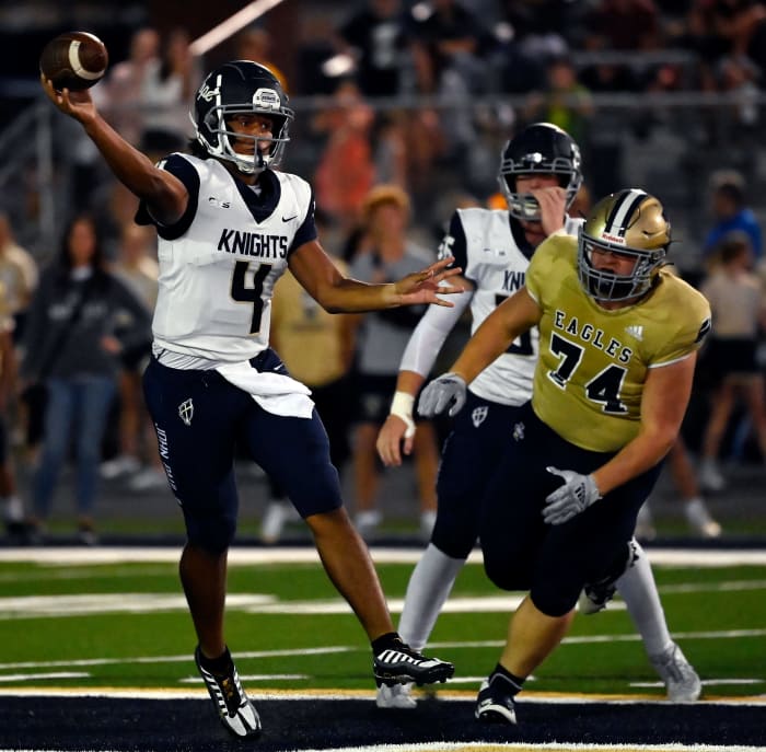 JPII quarterback Kenny Minchey (4) passes against Independence during a high school football game on Thursday, Sept. 8, 2022, in Thompson's Station, Tenn.