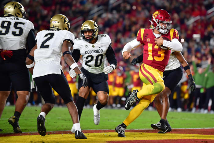 Nov 11, 2022; Los Angeles, California, USA; Southern California Trojans quarterback Caleb Williams (13) runs the ball in for a touchdown against the Colorado Buffaloes during the first half at the Los Angeles Memorial Coliseum.