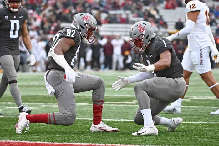 Nov 12, 2022; Pullman, Washington, USA; Washington State Cougars linebacker Travion Brown (82) and Washington State Cougars linebacker Daiyan Henley (1) celebrate after a play against the Arizona State Sun Devils in the second at Gesa Field at Martin Stadium. Washington State won 28-18.
