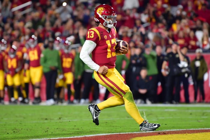 Nov 11, 2022; Los Angeles, California, USA; Southern California Trojans quarterback Caleb Williams (13) scores a touchdown against the Colorado Buffaloes during the first half at the Los Angeles Memorial Coliseum.