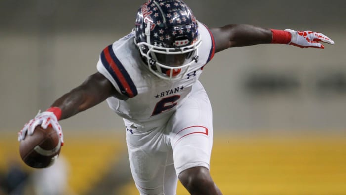 Denton Ryan running back Anthony Hill Jr. (6) lunges for extra yardage before going out of bounds during a 2nd quarter rush in their game against College Station. The two teams played their Class 5A Division 1 Region ll final playoff football game at Baylor's McLane Stadium in Waco on December 3, 2021.