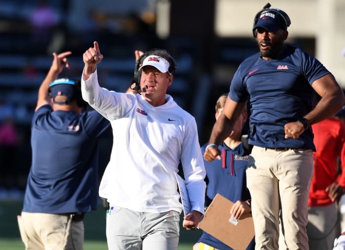 Oct 8, 2022; Nashville, Tennessee, USA; Mississippi Rebels head coach Lane Kiffin and other coaches celebrate after a recovered fumble against the Vanderbilt Commodores during the second half at FirstBank Stadium.