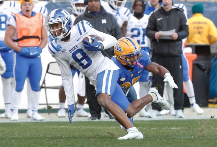 Nov 19, 2022; Pittsburgh, Pennsylvania, USA; Duke Blue Devils wide receiver Jordan Moore (8) runs after a catch against Pittsburgh Panthers defensive back A.J. Woods (25) during the fourth quarter at Acrisure Stadium. Pittsburgh won 28-26.